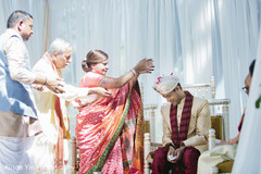 Indian groom during the ceremonial rituals Indian groom during the ceremonial rituals
