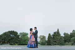 Indian bride and groom posing for pictures Indian bride and groom posing for pictures