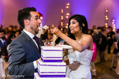 Indian bride giving cake to the groom lovely capture. Indian bride giving cake to the groom lovely capture.