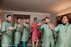 Indian groom with groomsmen having a toast. Indian groom with groomsmen having a toast.