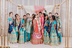 Indian groomsmen with bridesmaids posing with indian couple. Indian groomsmen with bridesmaids posing with indian couple.