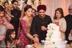 Indian bride and groom cutting cake moment. Indian bride and groom cutting cake moment.