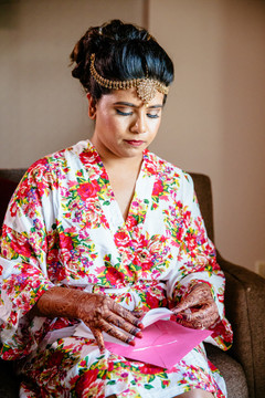 Enchanting Indian bride about to read grooms letter. Enchanting Indian bride about to read grooms letter.