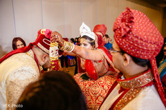 Indian bride putting groom a garland ritual. Indian bride putting groom a garland ritual.