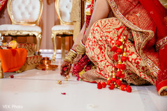 Indian bride putting the nuts for the Saptapadi ritual. Indian bride putting the nuts for the Saptapadi ritual.