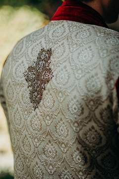 Detailed embroidery on rajahs sherwani. Detailed embroidery on rajahs sherwani.