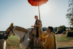Elegant Indian groom riding baraat white horse. Elegant Indian groom riding baraat white horse.