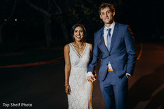 See this elegant Indian couple holding hands. See this elegant Indian couple holding hands.