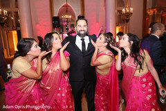 Indian groom posing with bridesmaids. Indian groom posing with bridesmaids.
