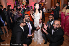 Lovely Indian bride posing with groomsmen. Lovely Indian bride posing with groomsmen.