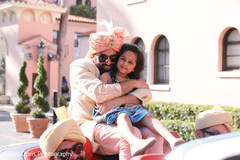 Joyful Indian groom hugging flower girl. Joyful Indian groom hugging flower girl.