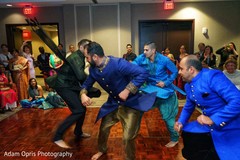 Indian groom on his upbeat sangeet dance. Indian groom on his upbeat sangeet dance.