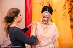 Maharani being assisted prior to the ceremony Maharani being assisted prior to the ceremony