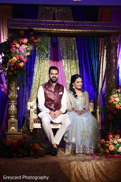Indian groom and Maharani smiling during pictures Indian groom and Maharani smiling during pictures