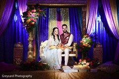 Indian bride and groom by the decor Indian bride and groom by the decor