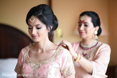 Maharani being assisted by her mother Maharani being assisted by her mother