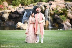 Indian bride and groom posing for pictures Indian bride and groom posing for pictures