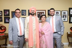 Indian groom posing with family members Indian groom posing with family members