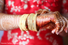 Indian bride with her golden bangles close up. Indian bride with her golden bangles close up.