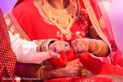 Indian bride and Groom showing their wedding rings. Indian bride and Groom showing their wedding rings.