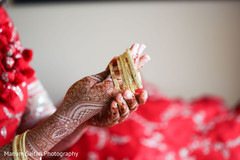 Indian bride putting her bangles on. Indian bride putting her bangles on.