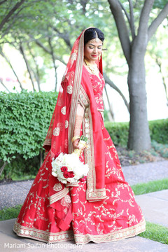 Indian bride glowing in her wedding attire. Indian bride glowing in her wedding attire.