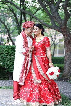 Indian bride and groom's romantic first look moment. Indian bride and groom's romantic first look moment.
