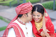Indian groom kissing bride capture. Indian groom kissing bride capture.