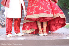 Indian couple showing their wedding shoes capture. Indian couple showing their wedding shoes capture.