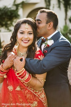 Indian groom kissing the bride. Indian groom kissing the bride.