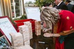 Indian wedding guest signing a Jenga block. Indian wedding guest signing a Jenga block.