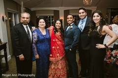 Glamorous Indian bride and groom with guests. Glamorous Indian bride and groom with guests.