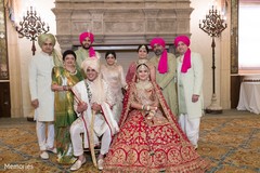 Indian bride and groom posing with special guests Indian bride and groom posing with special guests