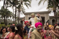 Indian groom being lifted by special guests Indian groom being lifted by special guests