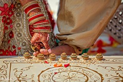 Indian groom touching the nuts with his toes ritual. Indian groom touching the nuts with his toes ritual.