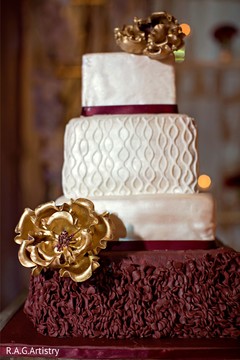 Magnificent Indian wedding cake golden flowers decoration. Magnificent Indian wedding cake golden flowers decoration.