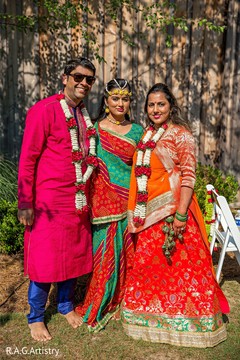 Indian bride posing with relatives at haldi party. Indian bride posing with relatives at haldi party.