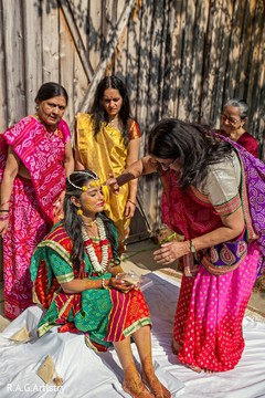 Maharani getting the turmeric paste on. Maharani getting the turmeric paste on.