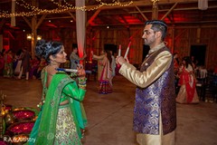 Indian couple with their dandiya sticks dancing. Indian couple with their dandiya sticks dancing.