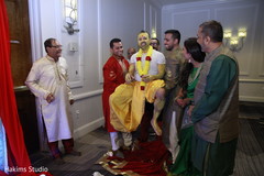 Indian groom lifted by groomsmen at haldi celebration. Indian groom lifted by groomsmen at haldi celebration.