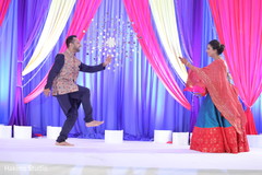 Indian bride and groom dancing at sangeet stage. Indian bride and groom dancing at sangeet stage.