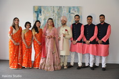 Indian couple posing with India bridesmaids and groomsmen. Indian couple posing with India bridesmaids and groomsmen.