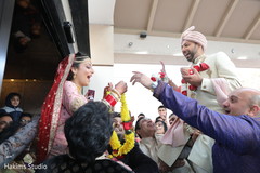 Maharani putting garland to groom at the Dwar Puja ritual. Maharani putting garland to groom at the Dwar Puja ritual.