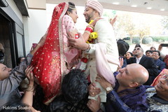 Indian bride and groom lifted at the entrance of ceremony venue. Indian bride and groom lifted at the entrance of ceremony venue.