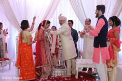 Indian groom putting garland to bride wedding ritual. Indian groom putting garland to bride wedding ritual.