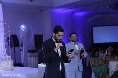 Indian wedding reception speech moment. Indian wedding reception speech moment.