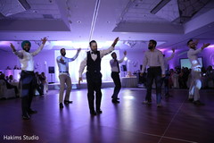 Joyful indian groomsman showing some dance moves Joyful indian groomsman showing some dance moves