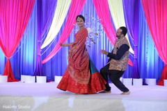 Indian couple at a sangeet dance capture. Indian couple at a sangeet dance capture.