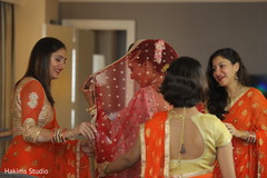 Indian bridesmaids helping bride getting ready. Indian bridesmaids helping bride getting ready.