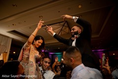 Bride being lifted by special guests Bride being lifted by special guests
